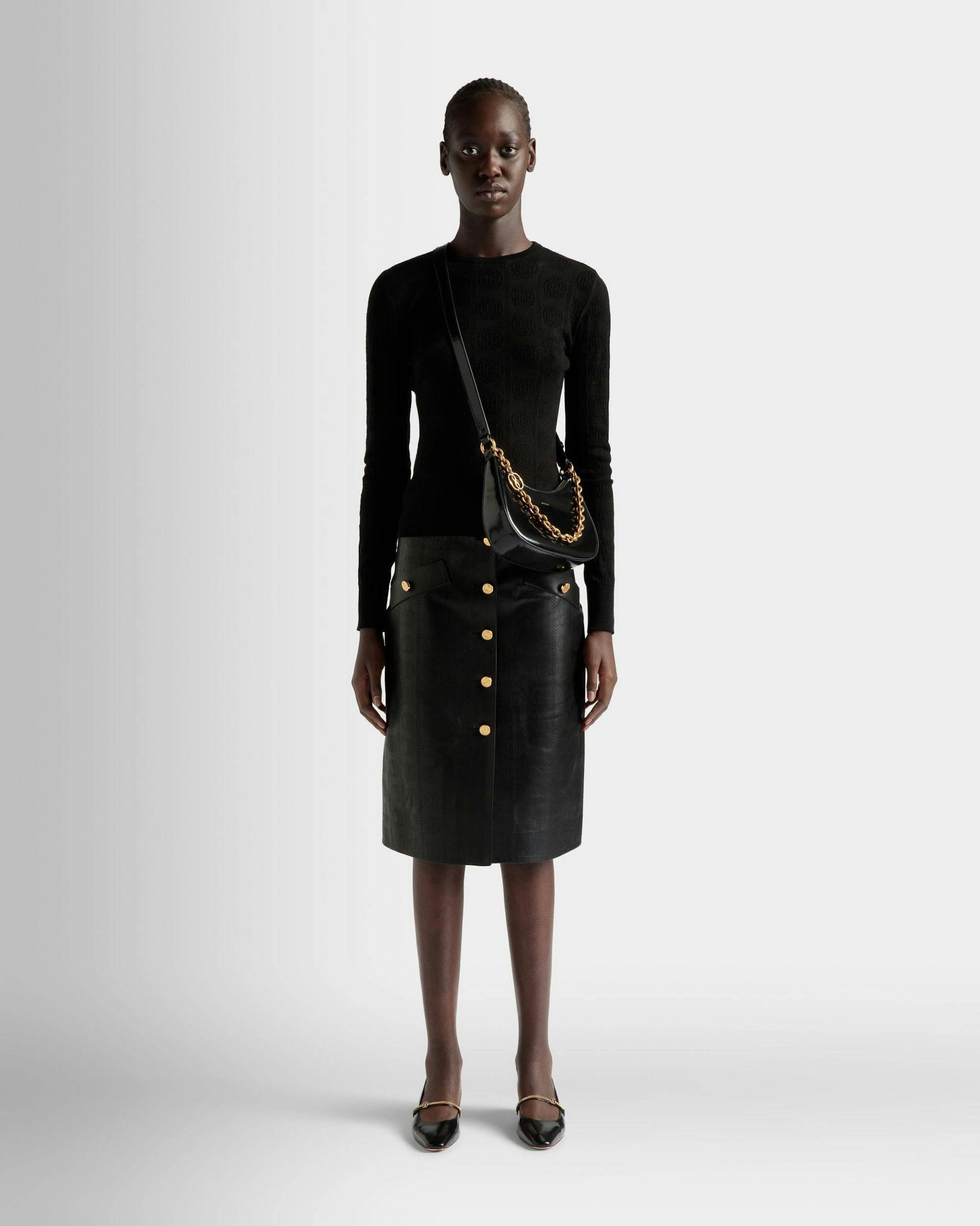 Women's Emblem Mini Crossbody Bag in Black Patent Leather | Bally | On Model Front