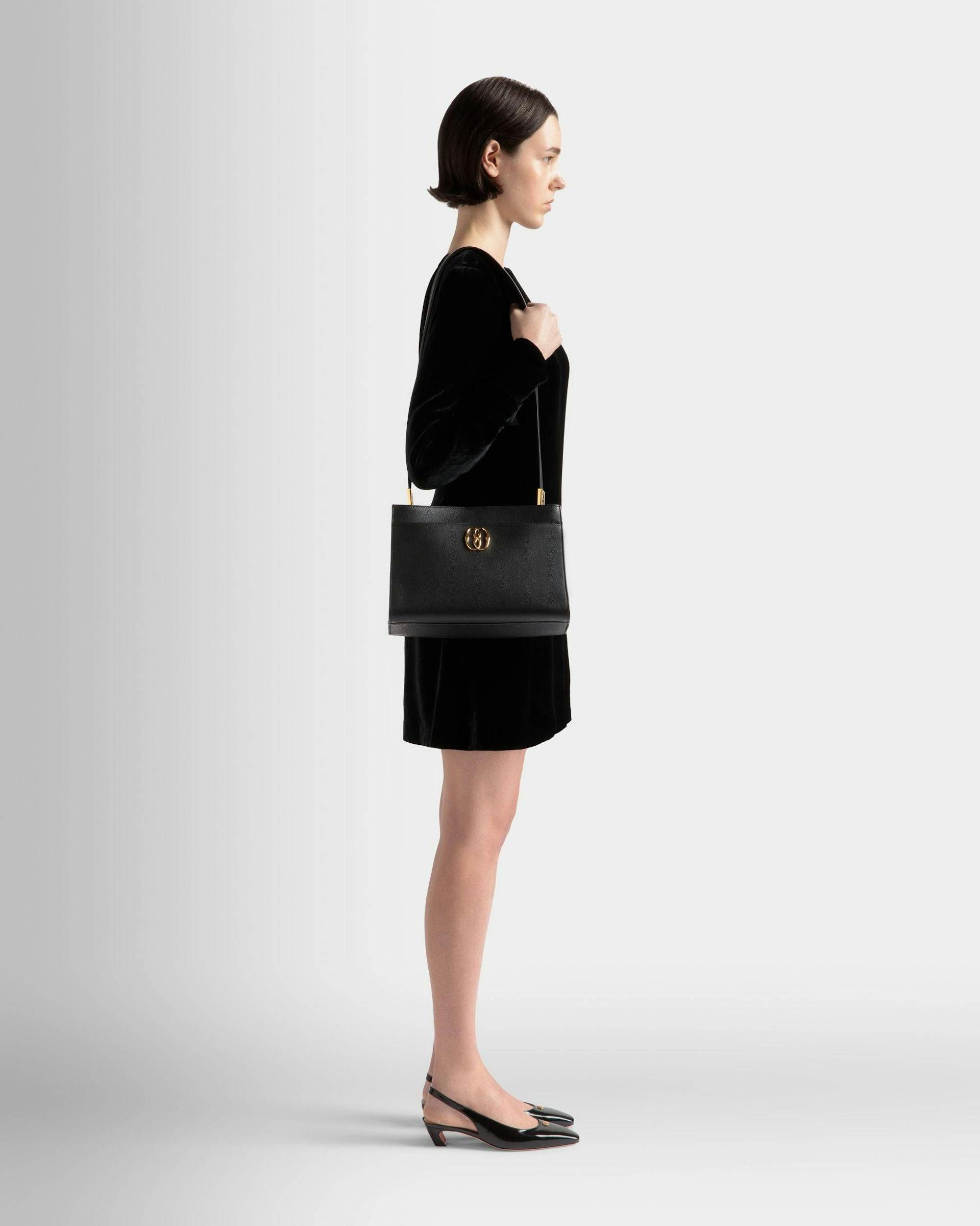 Women's Emblem Shoulder Bag In Black Grained Leather | Bally | On Model Front